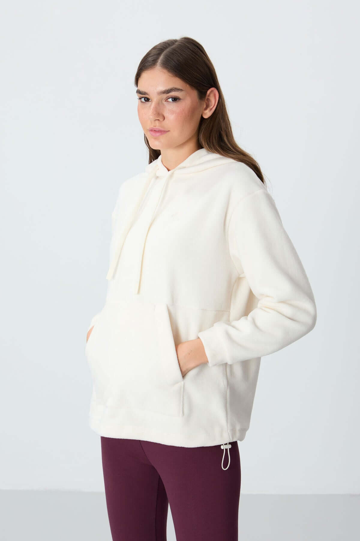 Ecru oversized hooded sweatshirt for women, made from soft fleece fabric, perfect for activewear and sportswear in Canada.